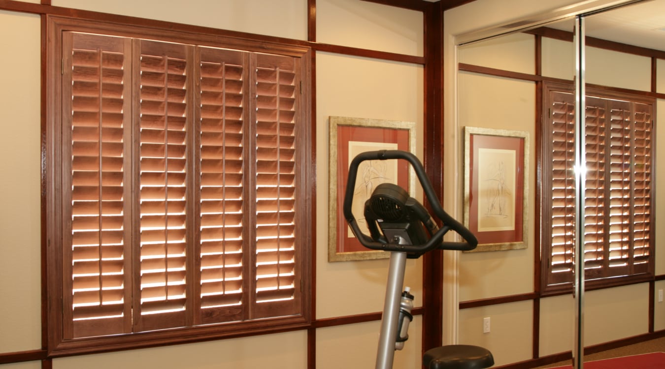 Plantation shutters in a home gym